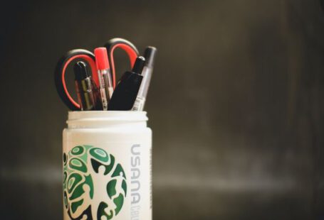 Storage Hacks - white and blue plastic cup with pens and pencils