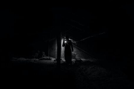 Backyard Landscape - Low Angle View of Man Standing at Night