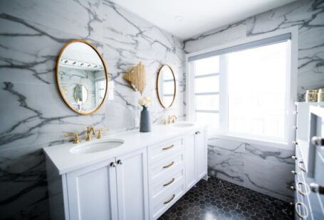 Bathroom Makeover - a bathroom with two sinks and a large mirror