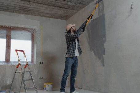 Home Remodeling - Man Painting the Wall