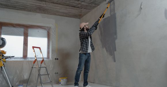 Home Remodeling - Man Painting the Wall