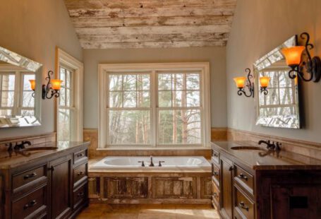 Bathroom Makeover - comfort room with white bathtub and brown wooden cabinets